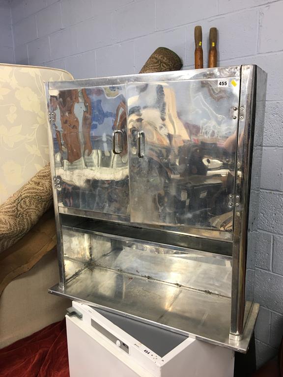 A 1950's chrome wall cabinet and a carpet square