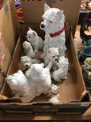 A box of West Highland Terriers figures