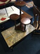 A marble top table and a four tier stand