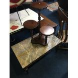 A marble top table and a four tier stand