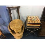 A glass and chrome folding table, wicker chair and table and four cushions