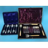 A set of silver cased silver spoons and a case of plated cutlery