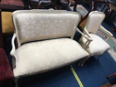 A French style cream upholstered settee and carver chair