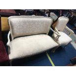 A French style cream upholstered settee and carver chair