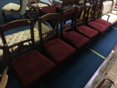 A set of six Edwardian walnut dining chairs