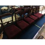 A set of six Edwardian walnut dining chairs