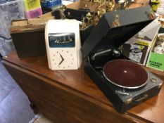 A pale pink Vitascope (cracked), wind up gramophone and records