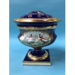 A large 19th century porcelain table centre rose bowl, on a cobalt ground, decorated with panels