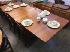 A teak dining table, by McIntosh and Co. Ltd, Kirkcaldy and four chairs, 236cm length, 92cm wide
