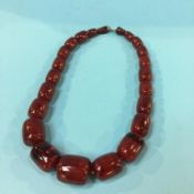 A string of amber coloured beads, weight 81.2 grams