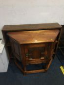 An oak side cabinet and bookcase