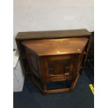 An oak side cabinet and bookcase