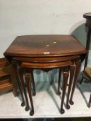 A mahogany drop flap nest of tables