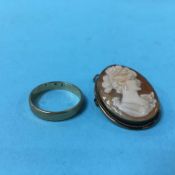 A 9ct gold wedding band, weight 2 grams and a small cameo, stamped '800'