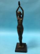 A modern bronze figure of a Deco lady with arms aloft