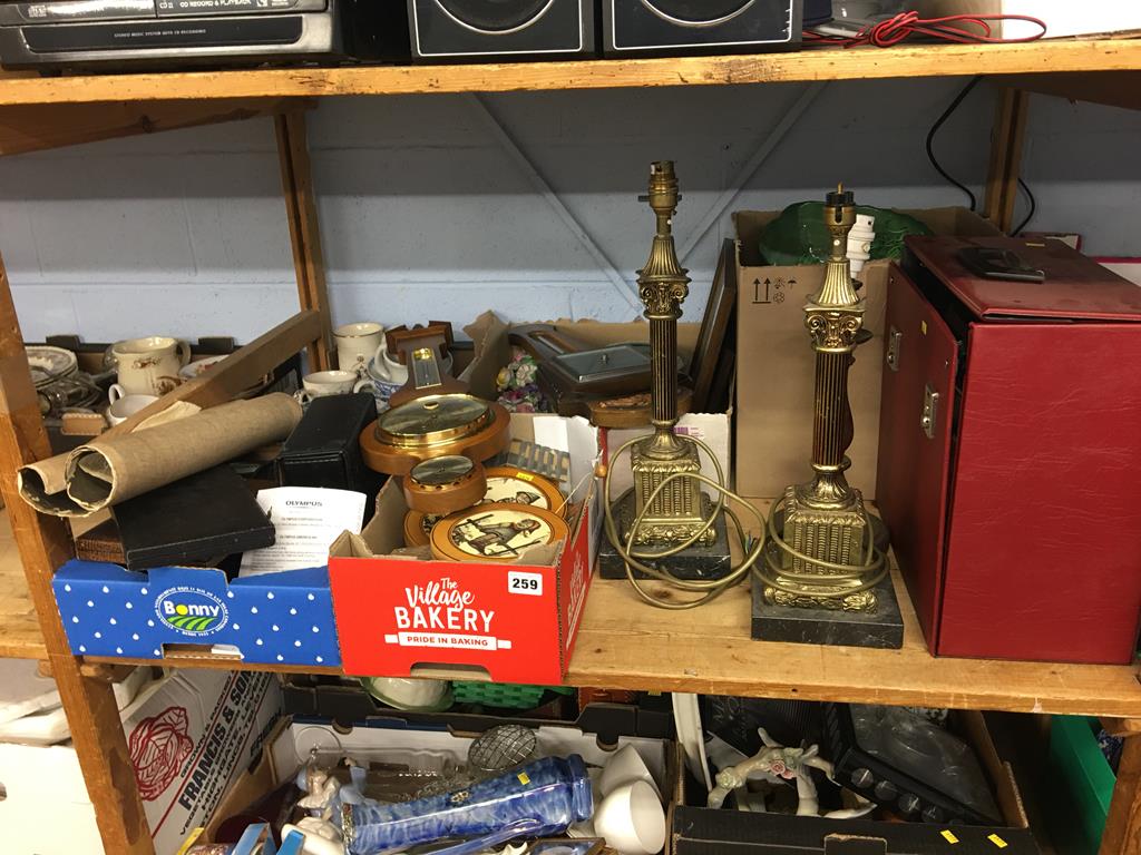 A shelf of assorted, to include barometers and standard lamps etc.