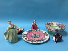 Three pieces of Maling pottery, a Royal Crown Derby Badger paperweight and two Doulton figures