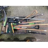 A wheelbarrow and garden tools