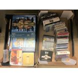 Two boxes including CDs and puzzles