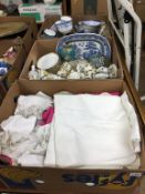 Three boxes of assorted china and linen