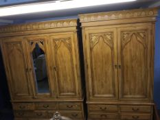 A Gothic design pine three door wardrobe and a double door wardrobe Condition Report The three