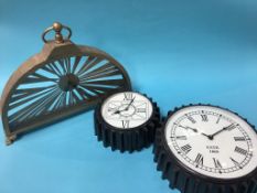 A modern clock and two Industrial style clocks