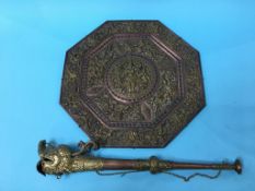 A South East Asian copper and brass octagonal wall plaque and a horn