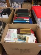 Three boxes of stamps, postcards etc.