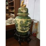 A large Chinese decorative vase and cover, with wooden stand, overall size 78cm high Condition