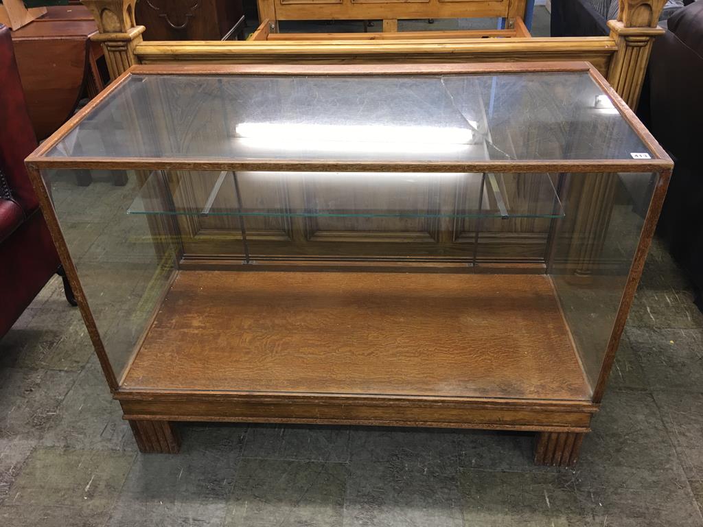 An oak glazed Shop cabinet