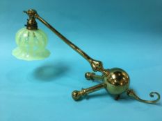 An early 20th century brass table lamp, in the style of W.A.S. Benson, with pearline glass shade