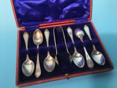 A cased set of silver spoons and a set of sugar nips