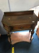 A carved oak side table