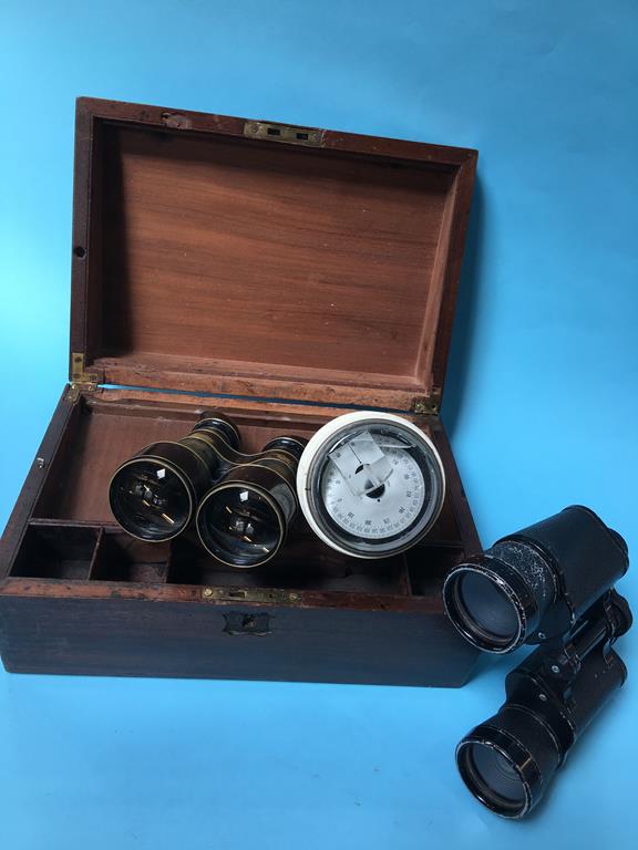 Writing slope, compass and binoculars