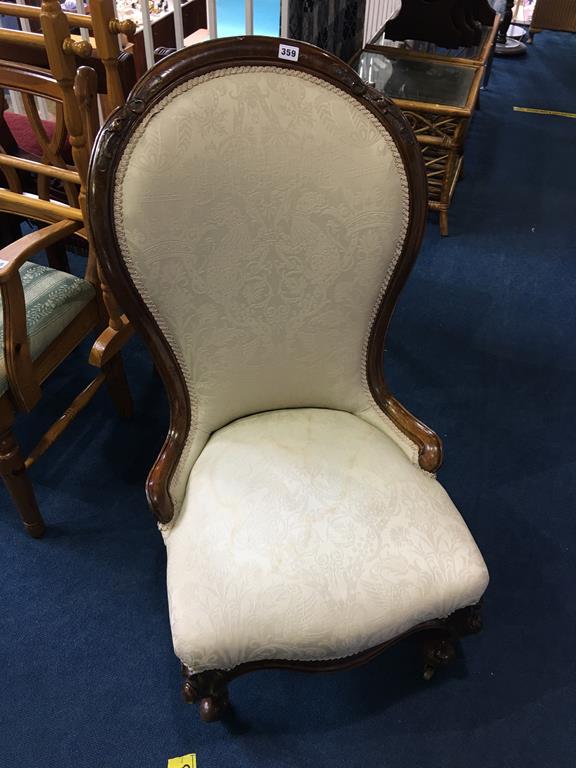 A Victorian walnut spoon back chair