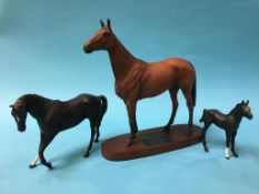 Beswick Red Rum on stand and two Beswick horses