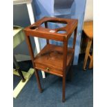 A mahogany two tier stand