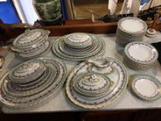 A very large opaque porcelain dinner service comprising: 12 oval graduated meat plates, large tureen