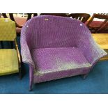 A purple Lloyd Loom two seater settee