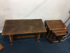An oak nest of tables and an oak coffee table