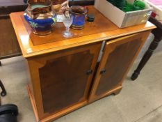 A walnut dressing table and yew wood cabinet