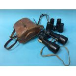Two pairs of military binoculars, one pair marked 6 x 30 and dated 1944, the other pair marked x7