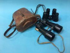 Two pairs of military binoculars, one pair marked 6 x 30 and dated 1944, the other pair marked x7