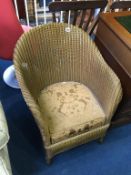 A gold Lloyd Loom chair