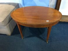 An Edwardian mahogany oval occasional table