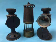 A pair of Miner's lanterns and a Miner's lamp