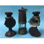 A pair of Miner's lanterns and a Miner's lamp