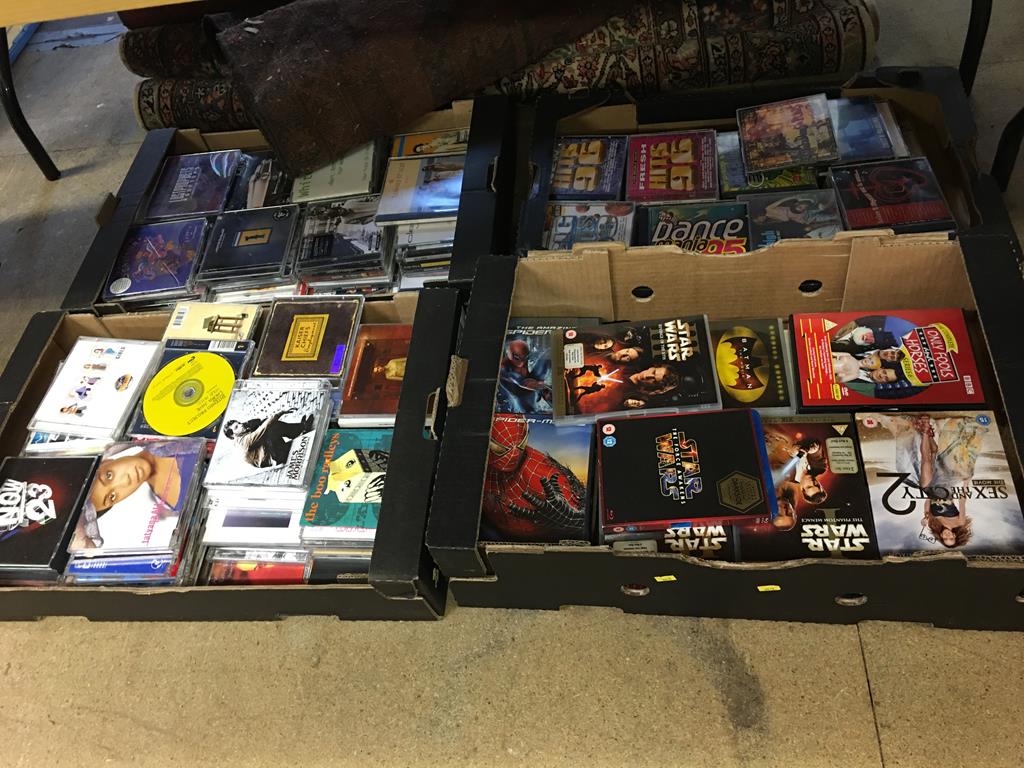 Four boxes of CDs and DVDs