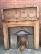 An Arts and Crafts oak fire surround, with copper hood, 143cm wide x 179cm high