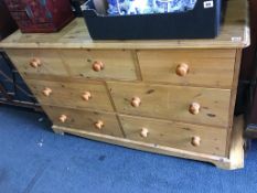 A pine chest of drawers